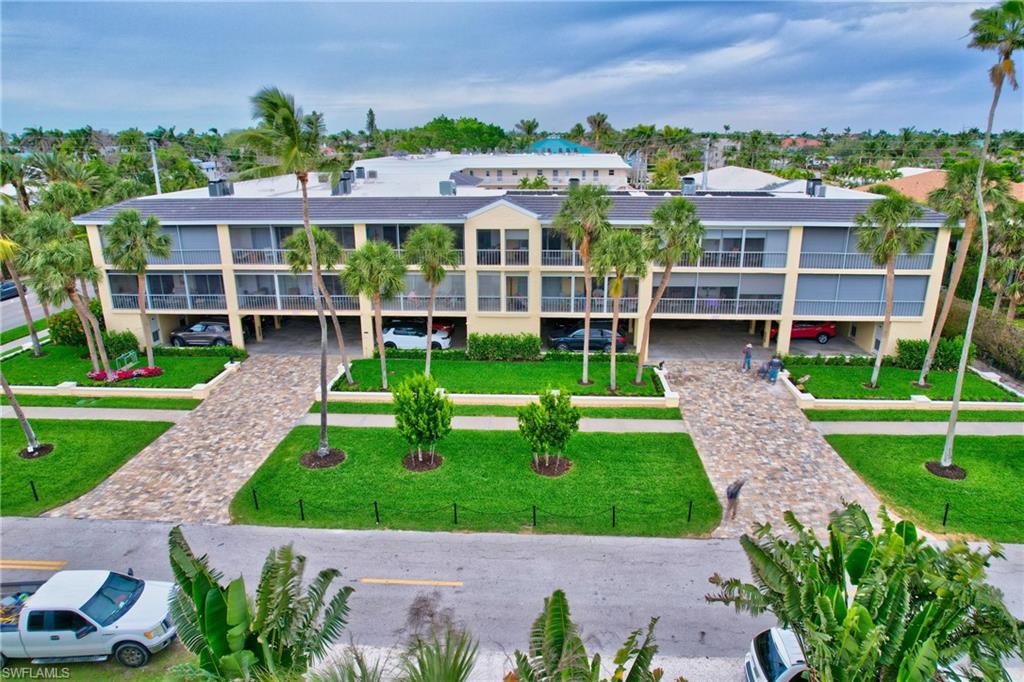 South Beach Club exterior with palm trees